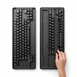 An illustration of the keyboard "case foam mod," showing a hand placing foam into the bottom of an open keyboard case to improve its sound acoustics.